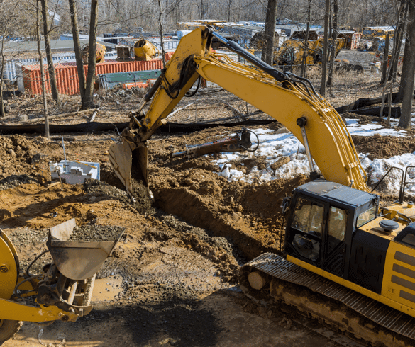 escavator over a trench